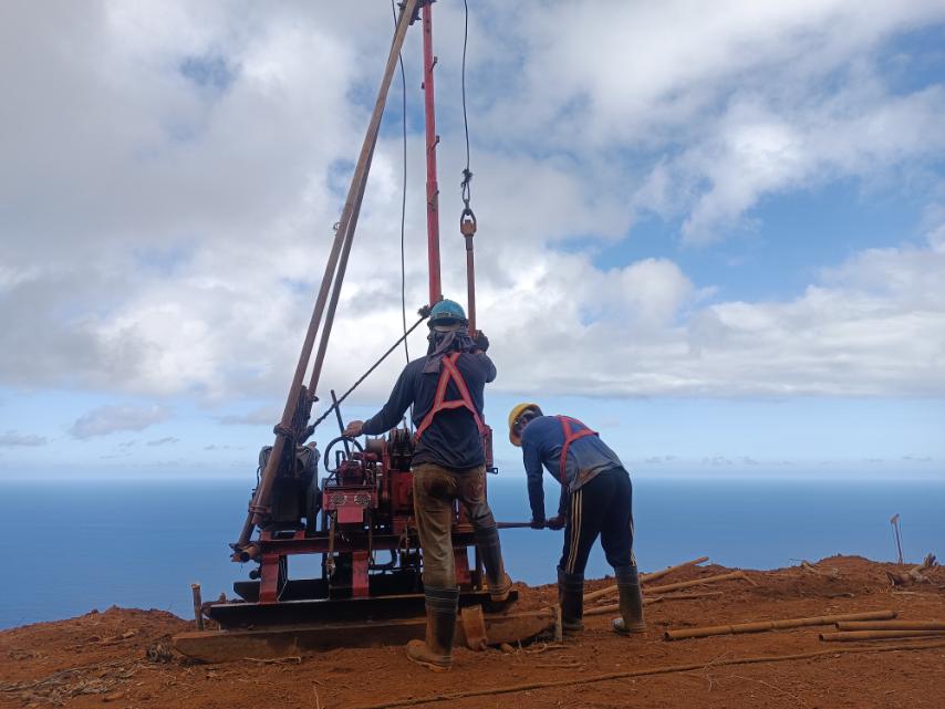 MEGA Philippines crew operating a core drilling rig for nickel exploration at a coastal project site