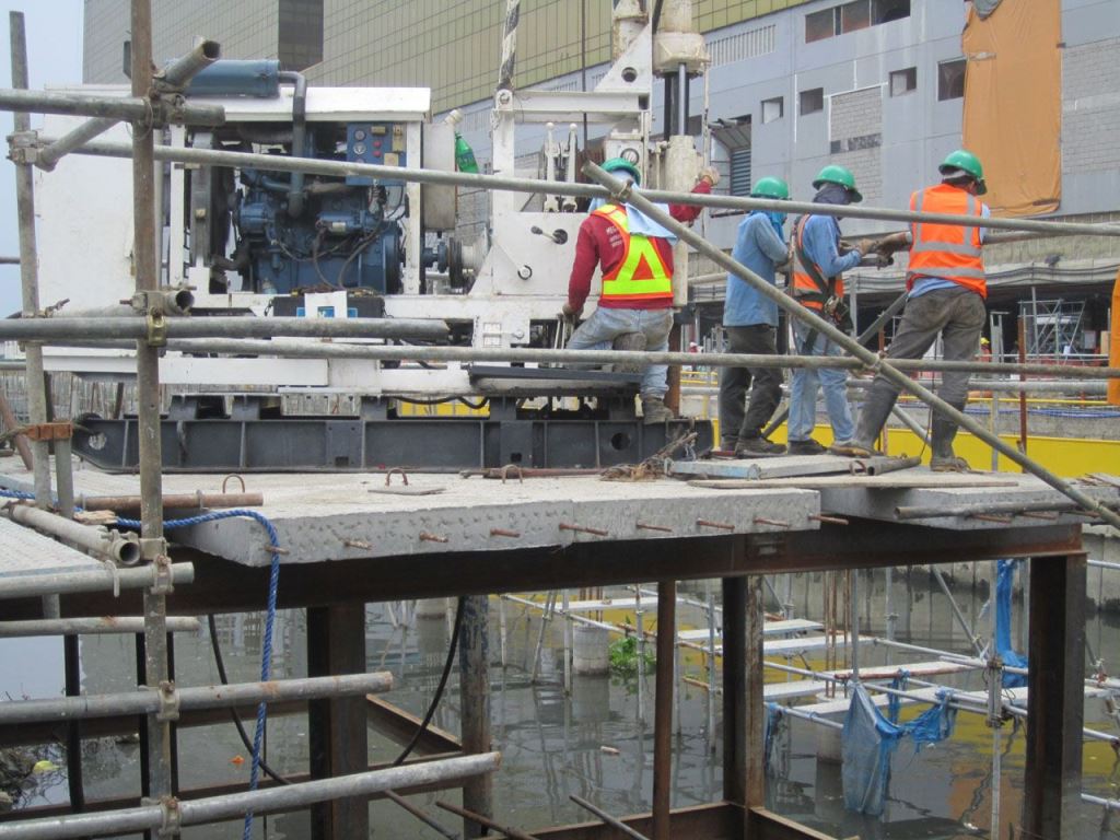 MEGA Philippines crew performing micropiling works on an elevated platform for a proposed reinforced concrete canal
