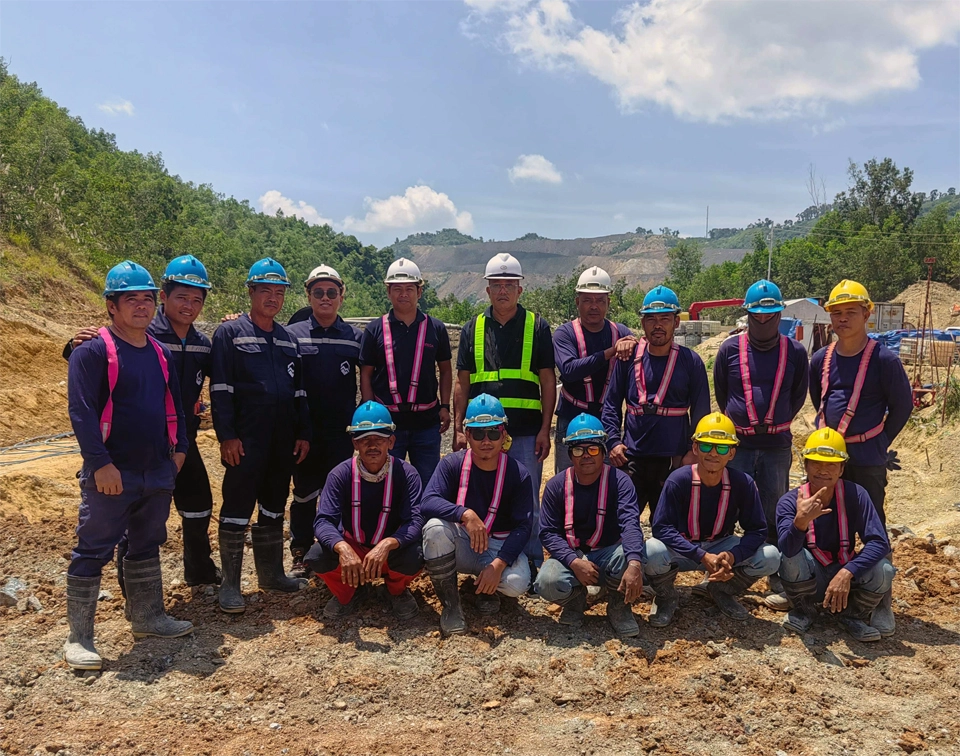 MEGA Philippines grouting team wearing safety helmets and harnesses at a project site in Cebu